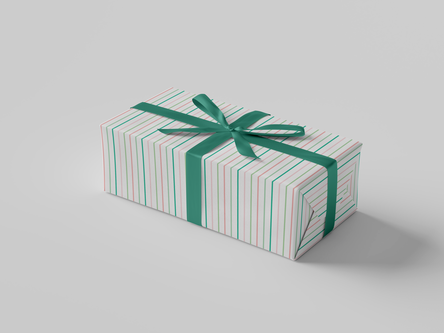 Side view of pink and green striped wrapping paper on a white background, inspired by Alpha Kappa Alpha sorority colors