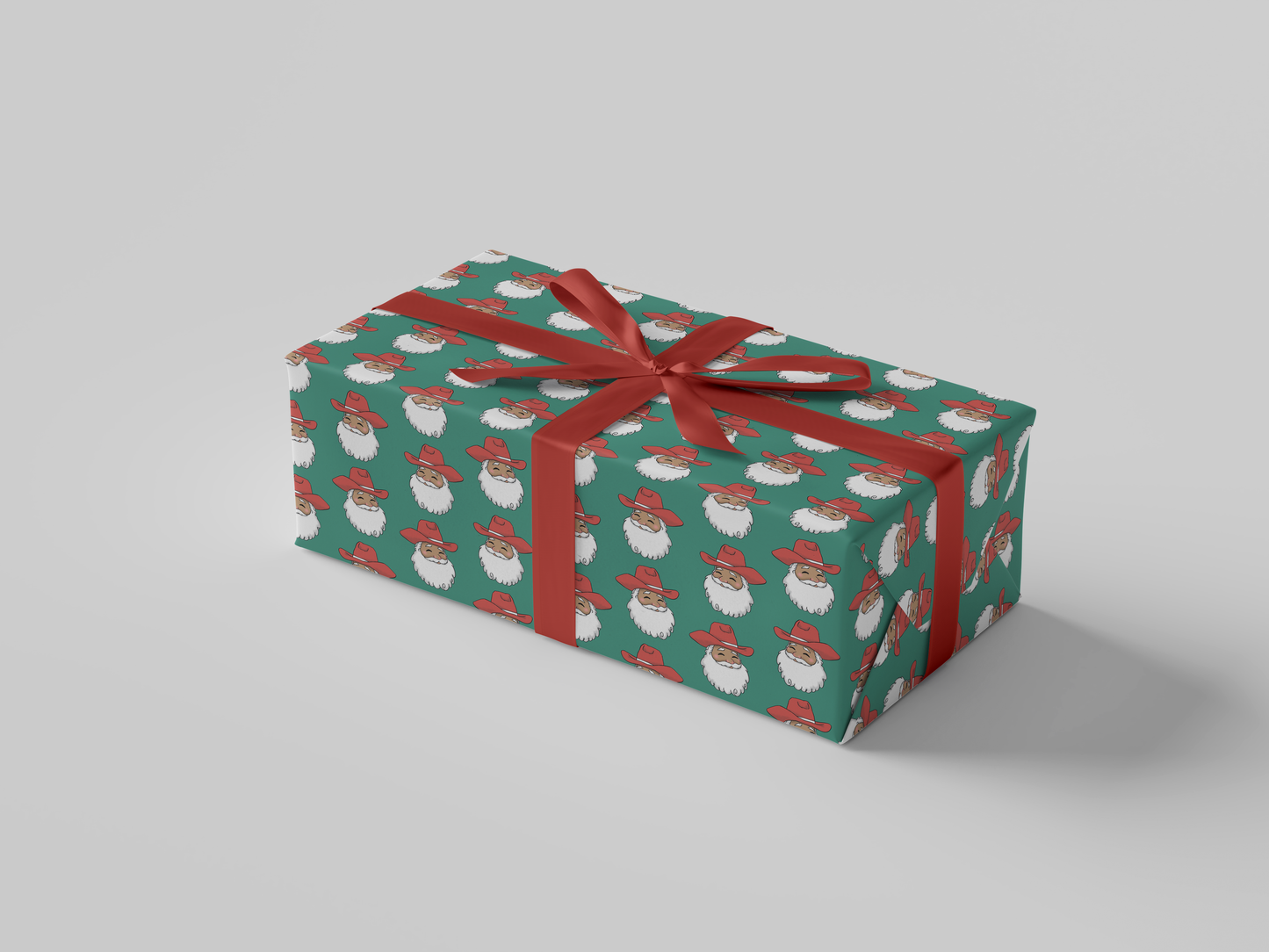 Side view of smiling Cowboy Santa Claus in a red cowboy hat, featured on green-colored Christmas wrapping paper