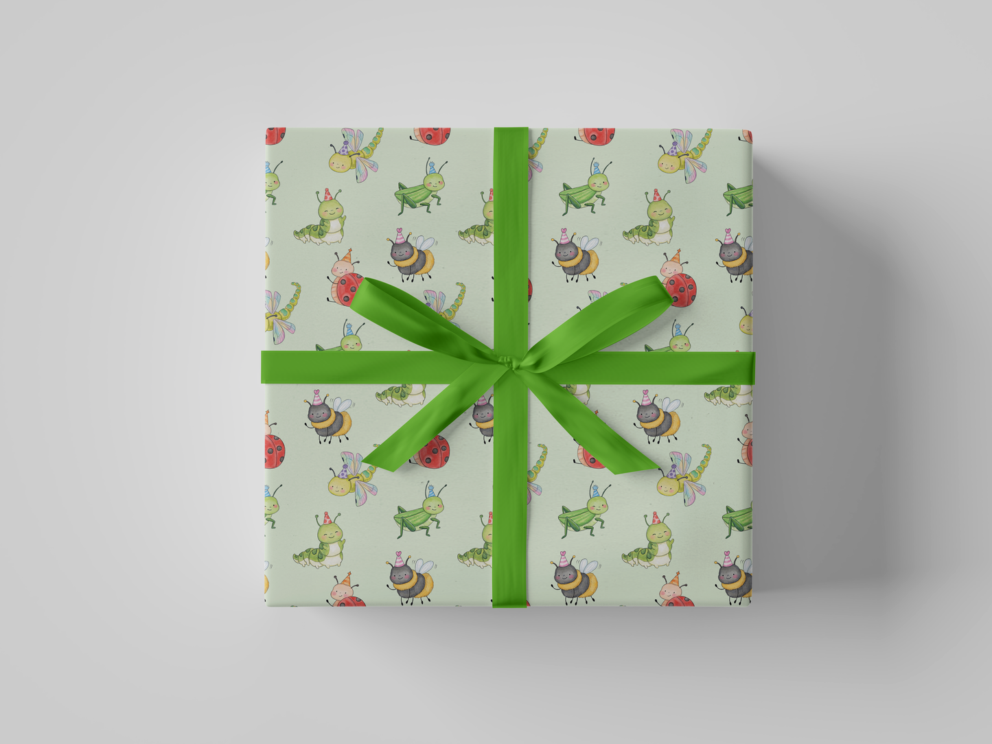 Front view of mint green wrapping paper featuring a playful pattern of watercolor-style party bugs, including ladybugs, bees, caterpillars, dragonflies, and grasshoppers wearing party hats.