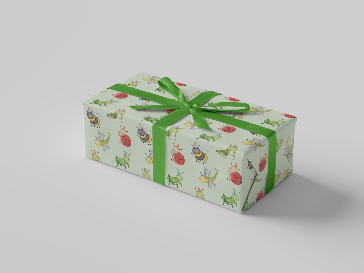Side view of mint green wrapping paper featuring a playful pattern of watercolor-style party bugs, including ladybugs, bees, caterpillars, dragonflies, and grasshoppers wearing party hats.