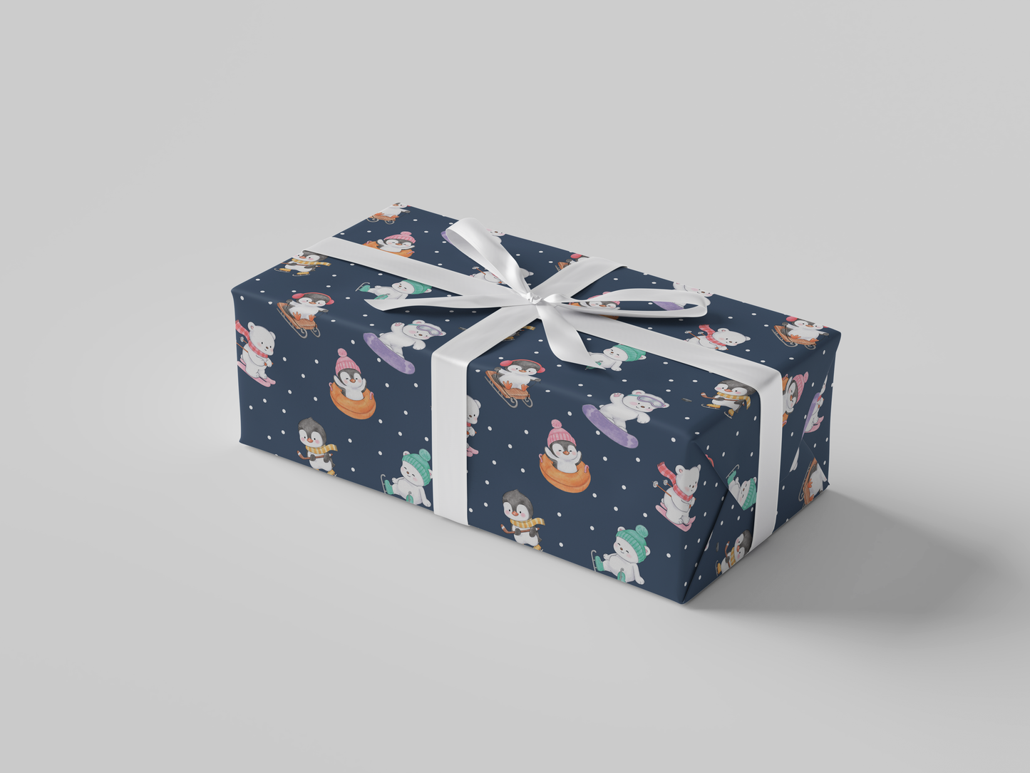 Side view of dark navy-colored wrapping paper featuring penguins and bears skiing, snow tubing, snowboarding, ice skating, playing hockey and sledding dressed in Christmas winter attire.