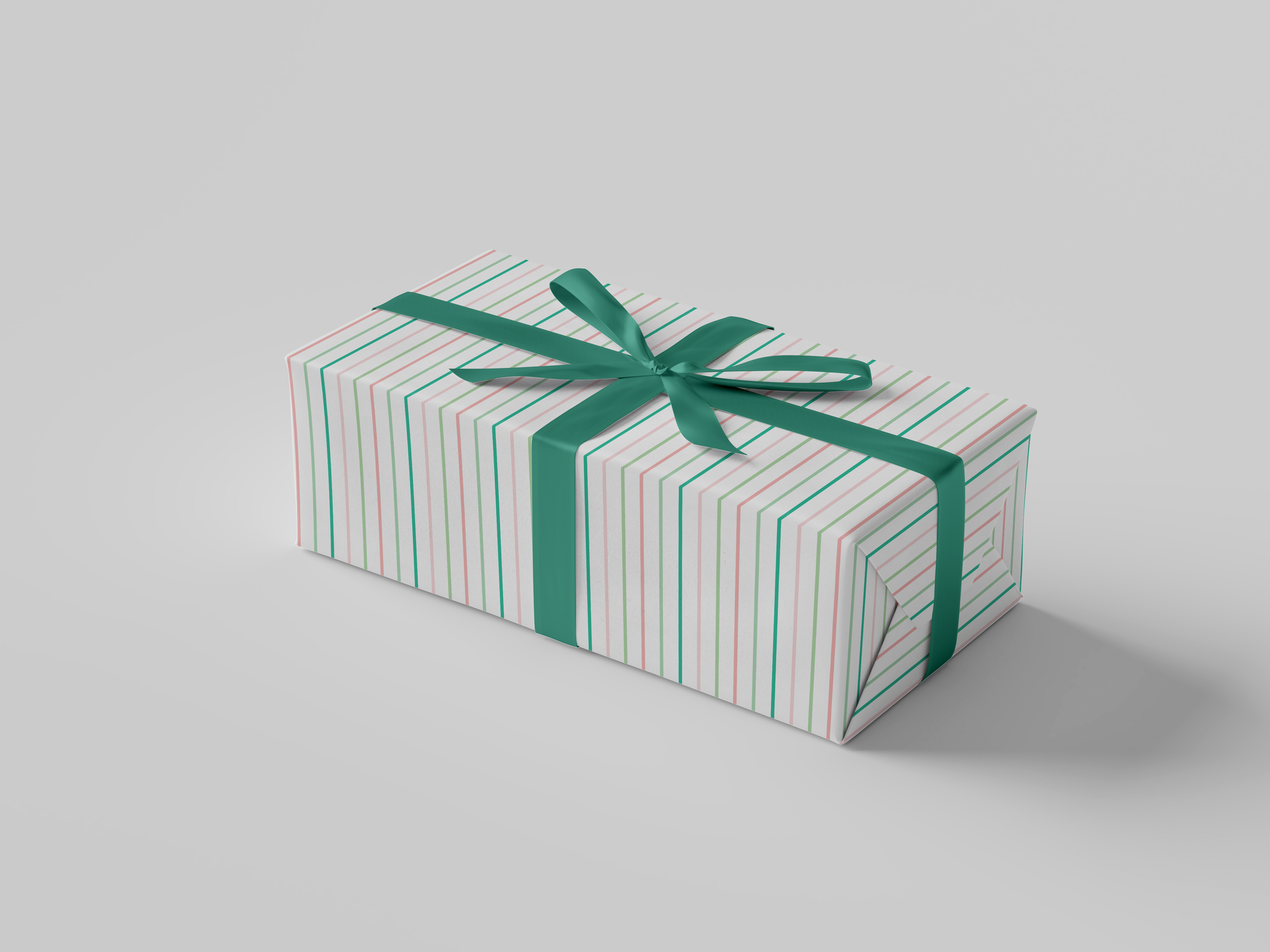 Side view of pink and green striped wrapping paper on a white background, inspired by Alpha Kappa Alpha sorority colors