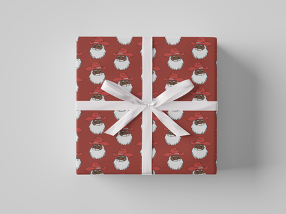 Front view of smiling Cowboy Santa Claus in a red cowboy hat, featured on red-colored Christmas wrapping paper