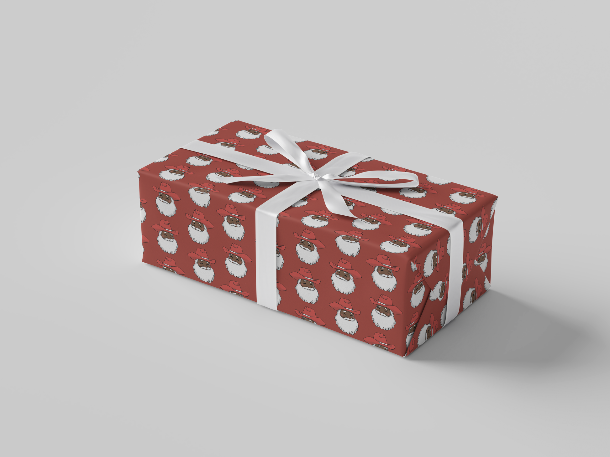 Side view of smiling Cowboy Santa Claus in a red cowboy hat, featured on red-colored Christmas wrapping paper