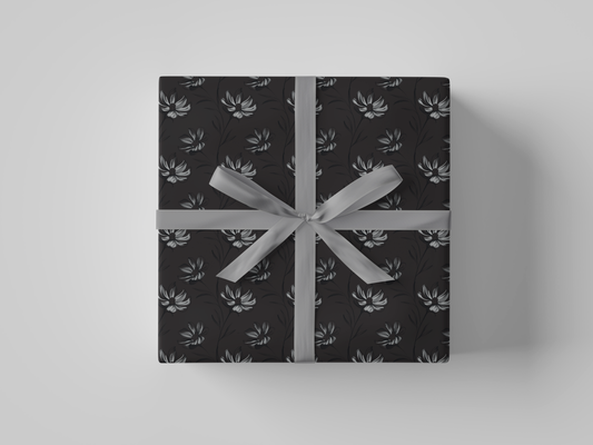 Front view of dark gray wrapping paper featuring intricate hand-drawn botanical illustrations in a structured floral design