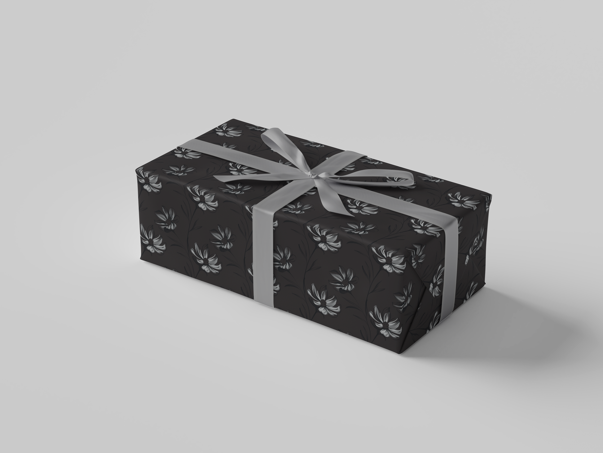 Side view of dark gray wrapping paper featuring intricate hand-drawn botanical illustrations in a structured floral design