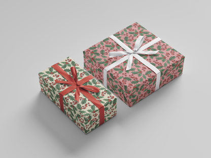 Side view displaying both pink and cream variants of wrapping paper, each decorated with Christmas holly, red berries, and green leaves.