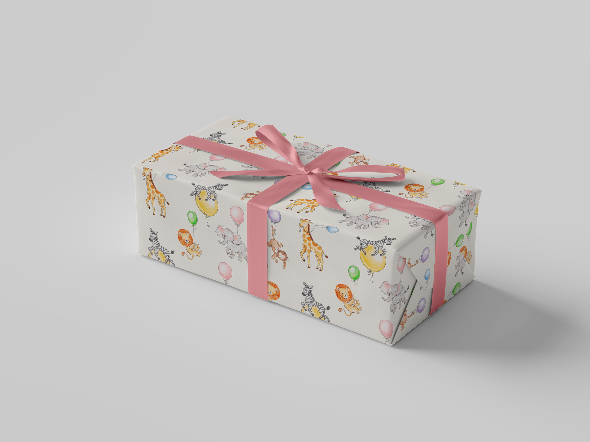 Side view of wrapping paper featuring watercolor illustrations of jungle animals - elephants, giraffes, lions, and zebras - celebrating with colorful balloons on a cream background.