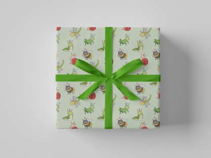 Front view of mint green wrapping paper featuring a playful pattern of watercolor-style party bugs, including ladybugs, bees, caterpillars, dragonflies, and grasshoppers wearing party hats.