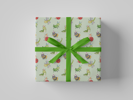 Front view of mint green wrapping paper featuring a playful pattern of watercolor-style party bugs, including ladybugs, bees, caterpillars, dragonflies, and grasshoppers wearing party hats.