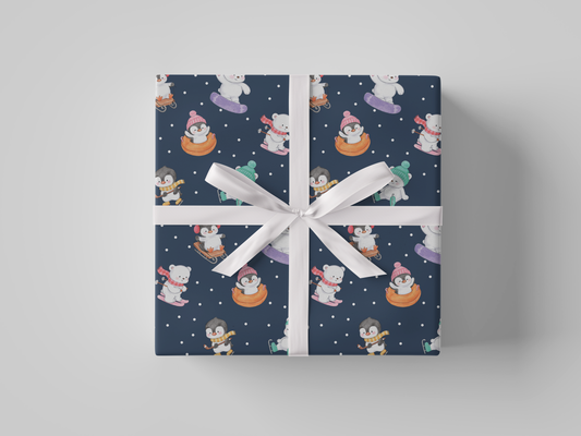 Front view of dark navy-colored wrapping paper featuring penguins and bears skiing, snow tubing, snowboarding, ice skating, playing hockey and sledding dressed in Christmas winter attire.