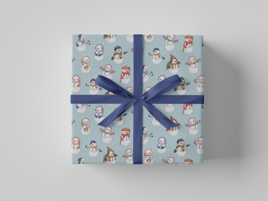 Front view of snowman and snowladies with Christmas lights, ornaments, coffee, presents, bag of gifts, bells, and snowballs posed against a backdrop of light blue-colored wrapping paper.